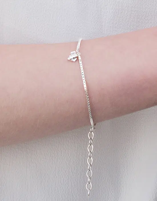 modern Scottish sterling silver silver charm bracelet inspired by the Churchill barriers, designed by Zoe in Stromness, Orkney, Scotland