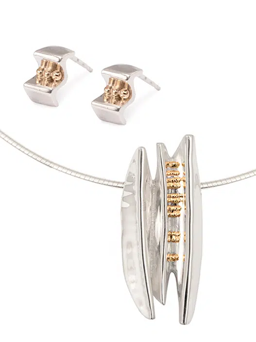 New designer jewellery set, comprising of a sterling silver pendant and earrings embellished with some gold