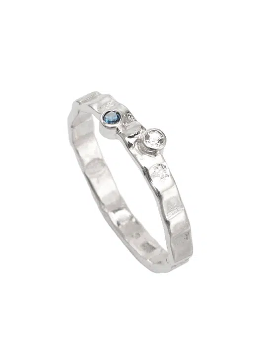 gemstone ring with blue and white topaz