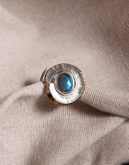 Handmade Labradorite statement ring showing hand-hammered sterling silver swirl.