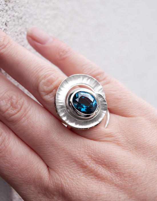 One of a kind London Blue Topaz cocktail ring with hand-hammered fold formed silver and 18ct yellow gold vermeil, handmade in Stromness, Orkney.