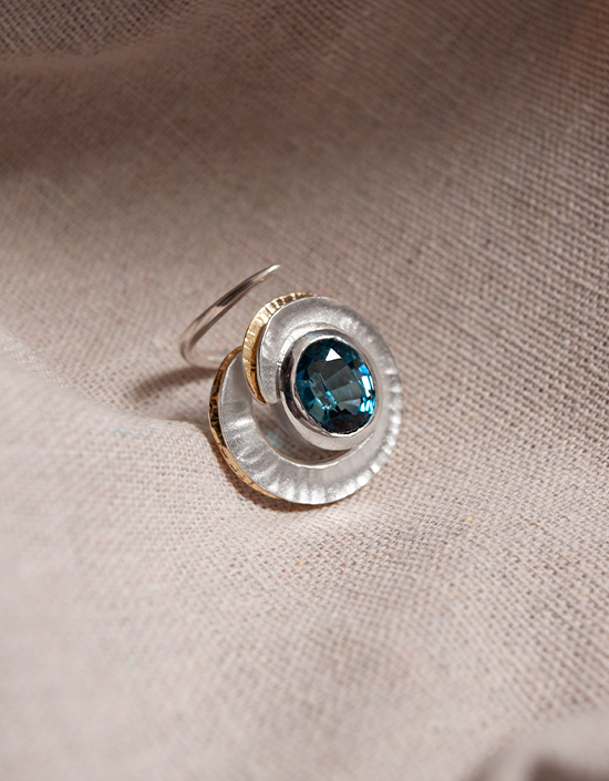 One of a kind London Blue Topaz cocktail ring with hand-hammered fold formed silver and 18ct yellow gold vermeil, handmade in Stromness, Orkney.